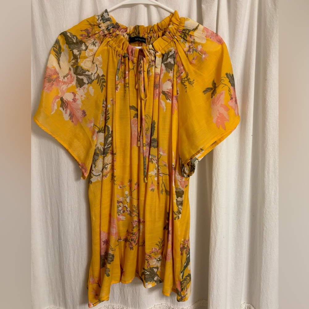 Summer top. Yellow with flowery print.